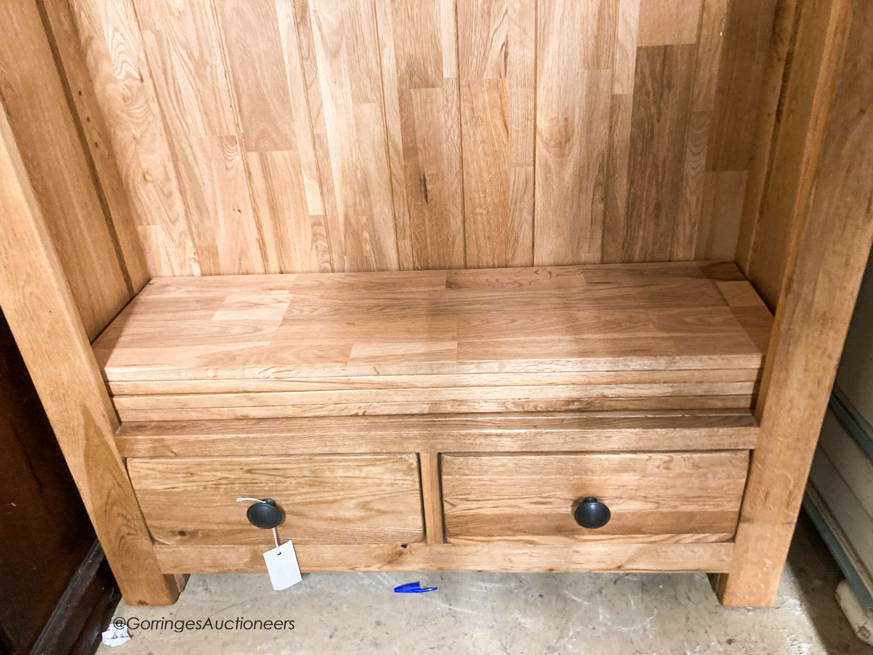 A contemporary light oak open bookcase, L.89cm D.27cm H.190cm